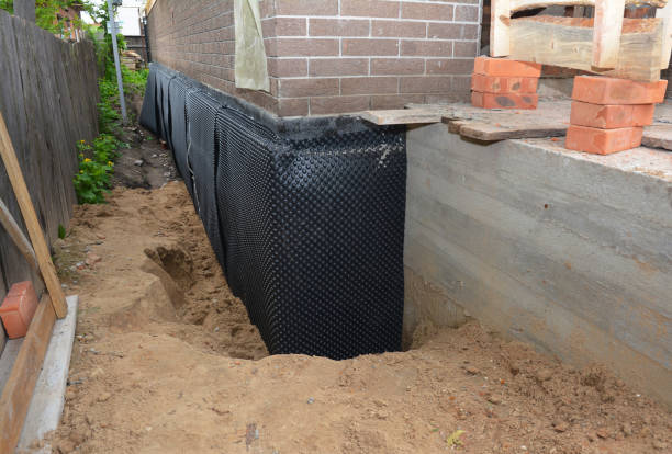 Happy homeowners after waterproofing job in Great Falls